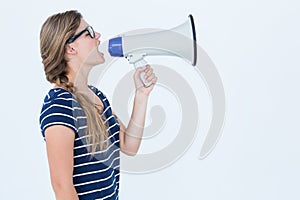 Woman shouting through a loudspeaker