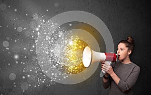 Woman shouting into megaphone and glowing energy particles explode