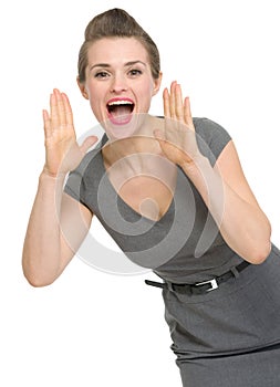Woman shouting through megaphone shaped hands
