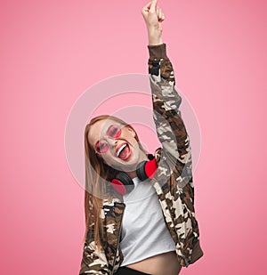 Woman shouting and raising hand