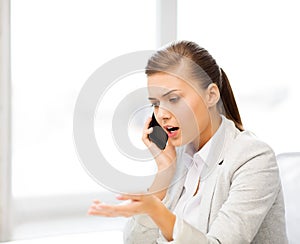 Woman shouting into smartphone