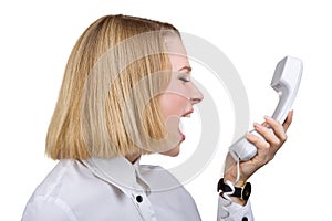 Woman shouting into the telephone receiver