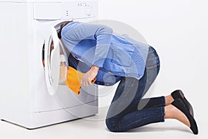 Woman shoved her head into washing machine.