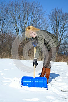 Woman shoveling