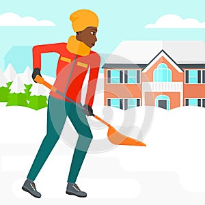 Woman shoveling and removing snow.