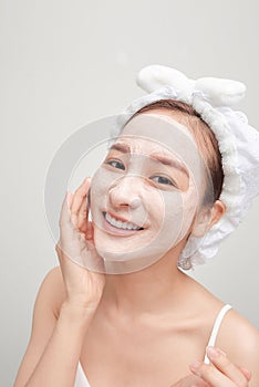 the woman after the shower put a mask on her face