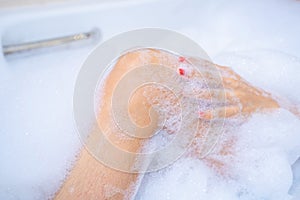 Woman shower and relaxing in bathtub