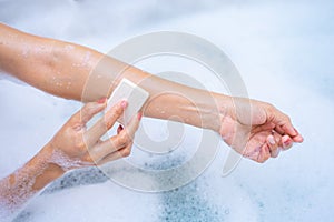 Woman shower and relaxing in bathtub