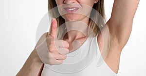 Woman showing armpit and thumb up gesture closeup 4k movie