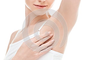 Woman showing armpits isolated on white. skin care woman concept