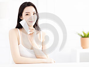 Woman showing beauty product on hand