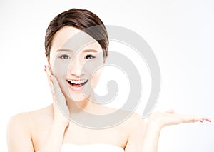 Woman showing beauty product on hand