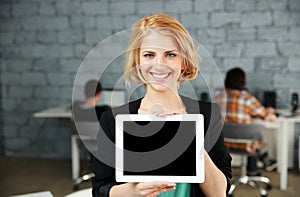 Woman showing blank tablet computer screen