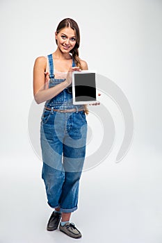 Woman showing blank tablet computer screen