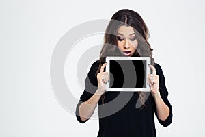 Woman showing blank tablet computer screen