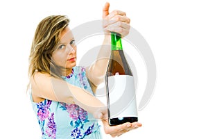 A woman showing bottle of red sparkling wine with blank etiquette