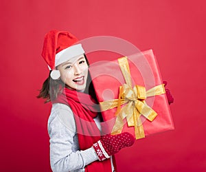 Woman showing the christmas gift box