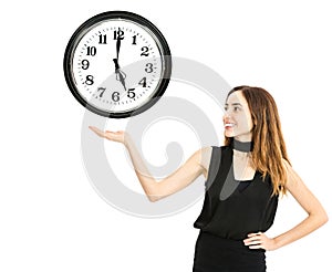 Woman showing a clock