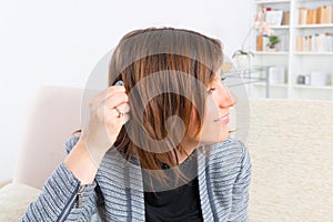 Woman showing cochlear implant