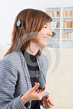 Woman showing cochlear implant