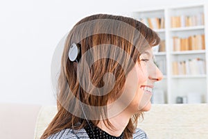 Woman showing cochlear implant