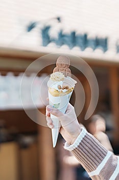 Woman showing Daibutsu or Buddha yogurt crepe, popular dessert in Kamakura, Kanakawa, Japan