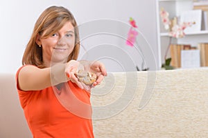 Woman showing deaf aids