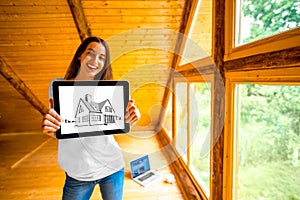 Woman showing digital tablet in the wooden house