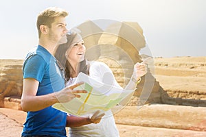 Woman Showing Direction To Man Holding Map