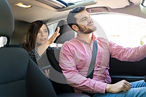 Woman Showing Direction To Taxi Driver