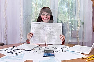Woman showing empty blanks of 1040 tax