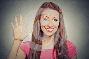 Woman showing five times sign gesture with hand