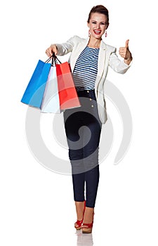 Woman showing French flag colours shopping bags and thumbs up