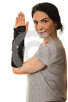 Woman showing hand in orthosis