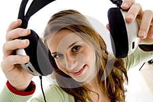 Woman showing headphone