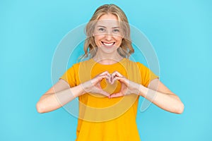 Woman showing heart shape, symbol of love
