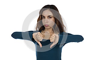 Woman showing her disapproval with thumbs down