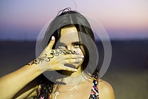 Woman showing her henna painting