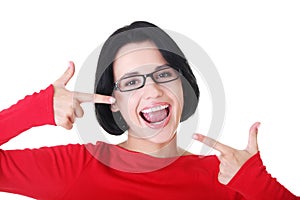 Woman showing her perfect straight white teeth.