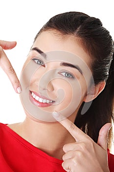 Woman showing her perfect straight white teeth.