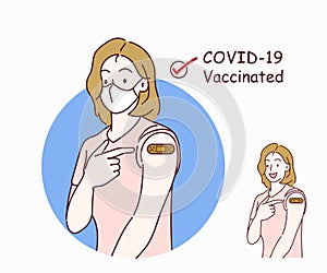 Woman showing his arm with band aid after coronavirus Covid-19 vaccine, wearing medical mask.