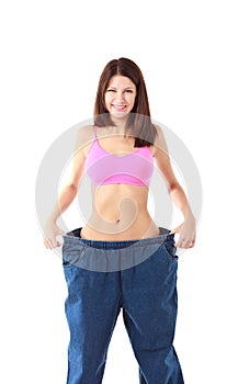 Woman showing how much weight she lost