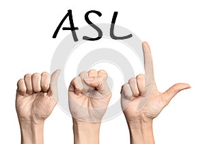 Woman showing letters ASL on white background.