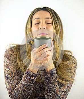 Woman showing love for her coffee