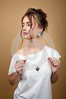 Woman showing off her jewelery in fashion concept wearing accessories and jewelry