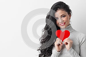 Woman showing paper heart