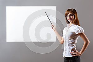 Woman showing with pointer to blank placard