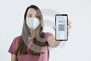 Woman Showing QR Code of Vaccination on a Mobile Phone