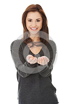 Woman showing something or copyspase