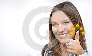 Woman showing thumb up five stars quality rating. Satisfaction. Copy space